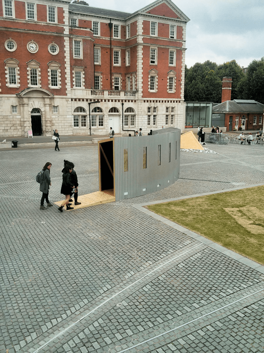 Anta Germane public artwork Interactive Tunnel constructed from steel sheets, timber, one way persepx mirrors, PIR sensors and lights, situated in London Rootstein Hopkins Parade Ground.